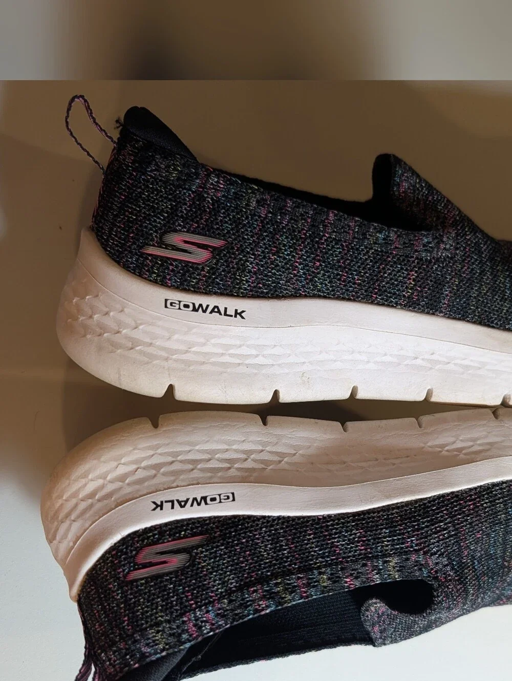 Skechers Slip-On Knit Sneakers in Black with Pink Accents